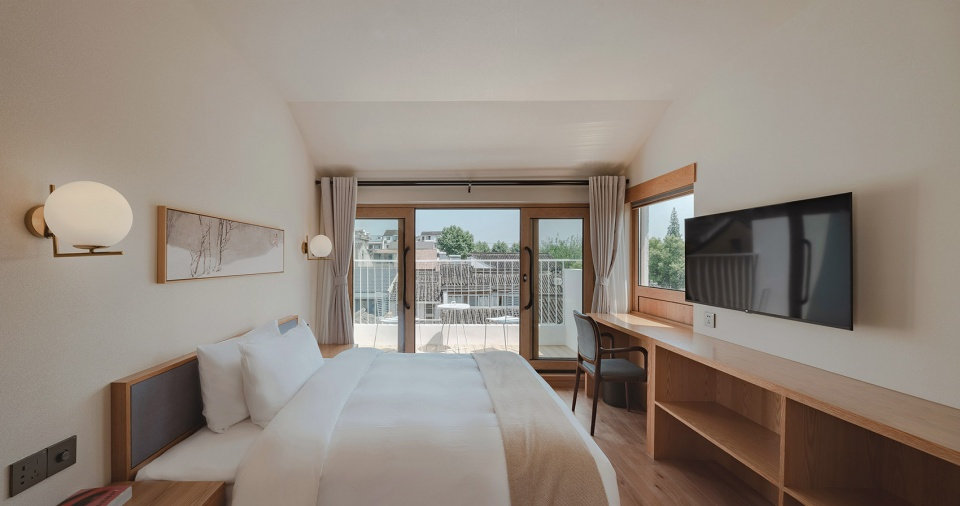 郑州旧房改民宿装修-花里精品民宿爱游戏最新官网_爱游戏(中国)装修实景图